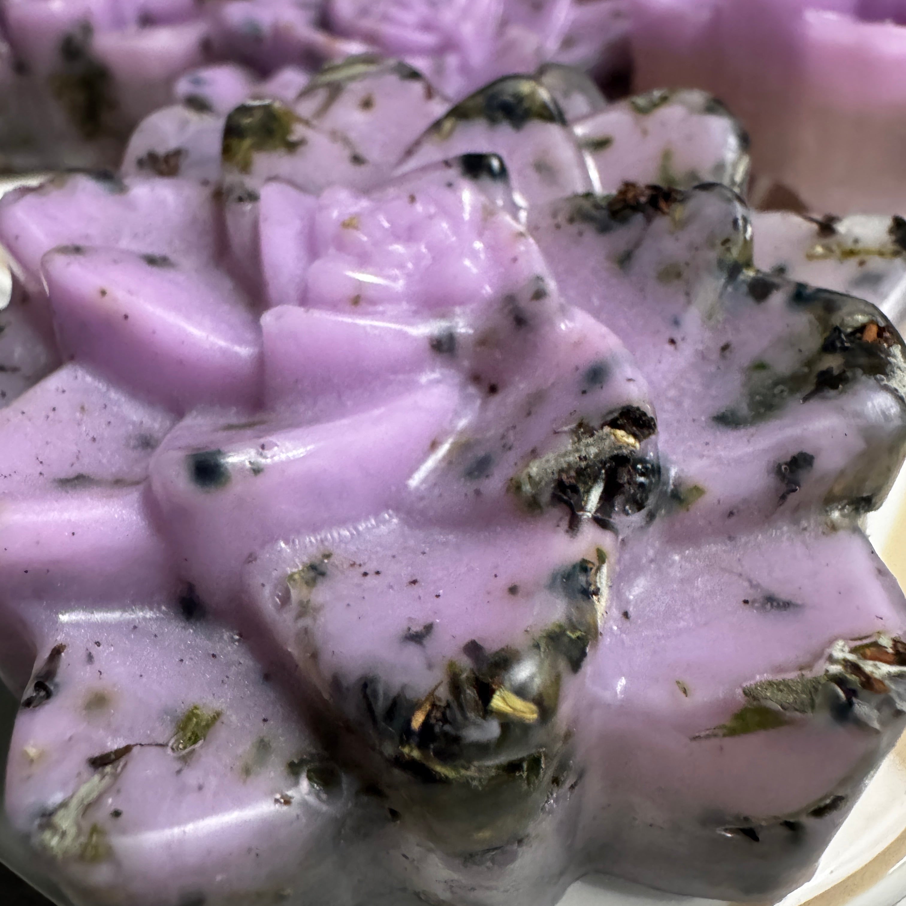 Blackwater Bath Bar – Lavender with Botanicals, close-up of lotus-shaped soap with embedded botanicals