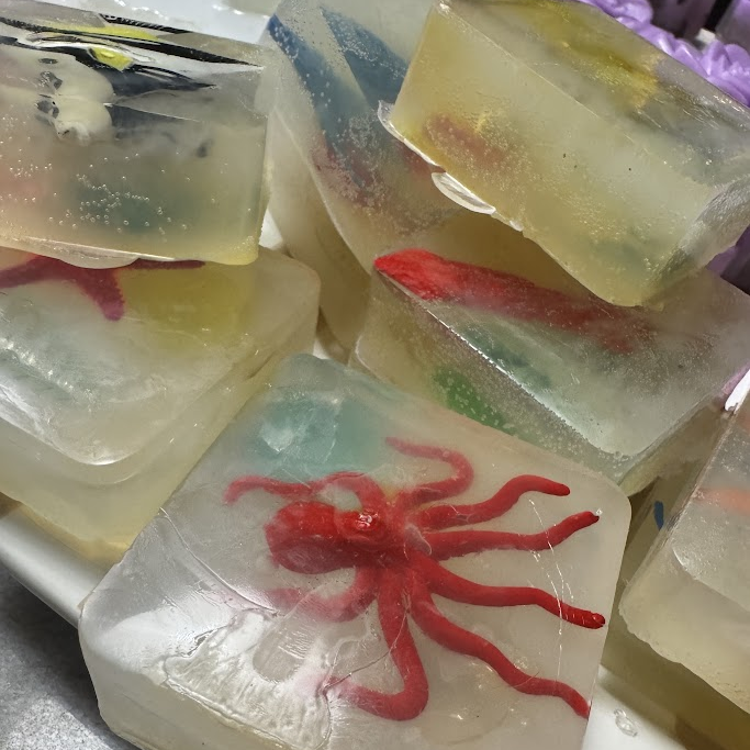 Handmade clear glycerin Pirate Treasure soap bars with embedded ocean creature toys, made in Surfside Beach SC